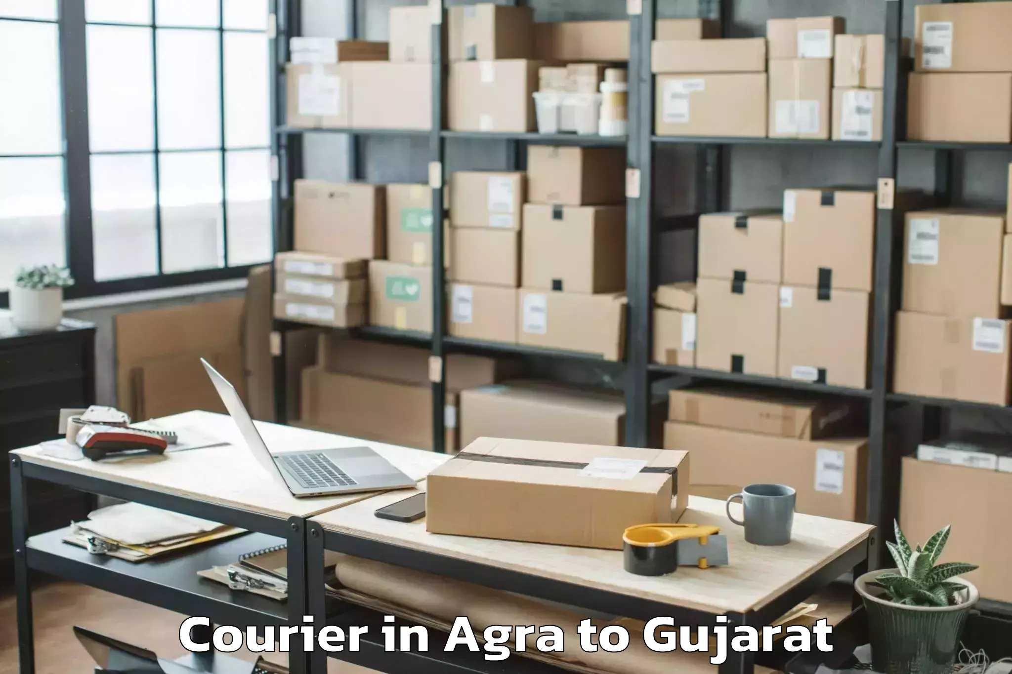 Reliable Agra to Dwarka Courier